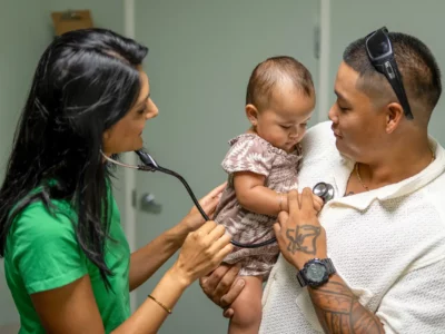 doctor examining toddler