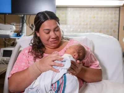 Mom with newborn in hospital bed